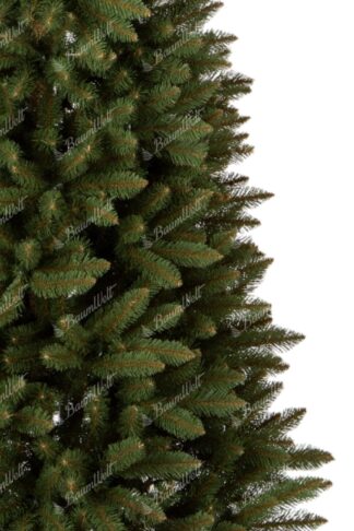 Künstlicher Weihnachtsbaum Nordische Fichte Schlan. Der Baum hat dicke grüne Nadeln.