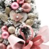 Schneebedeckter kleiner Weihnachtsbaum dekoriert Rosa 50cm mit rosa Verzierungen und Schleife
